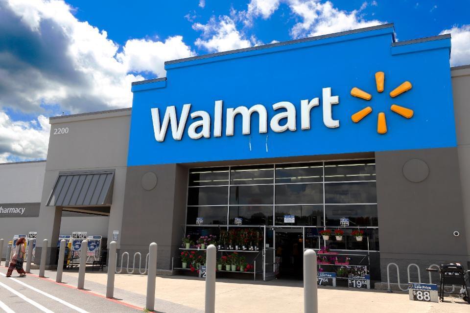 Walmart store entrance with digital and paper. how to use coupons at Walmart